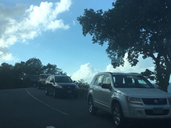 Four vehicles parked at the Trunk Bay overlook Saturday afternoon. 